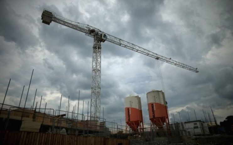 A crane is seen against a cloudy backdrop as Kier fell to a £245m loss