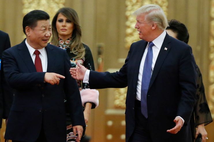 BEIJING, CHINA - NOVEMBER 9: U.S. President Donald Trump and China's President Xi Jinping arrive at a state dinner at the Great Hall of the People on November 9, 2017 in Beijing, China. Trump is on a 10-day trip to Asia. (Photo by Thomas Peter - Pool/Getty Images)