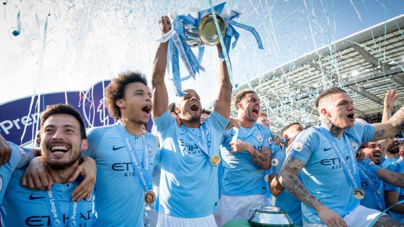 BRIGHTON, ENGLAND - MAY 12: Vincent Kompany of Manchester City lifts the Premier League trophy after the Premier League match between Brighton & Hove Albion and Manchester City at American Express Community Stadium on May 12, 2019 in Brighton, United Kingdom. (Photo by Michael Regan/Getty Images)