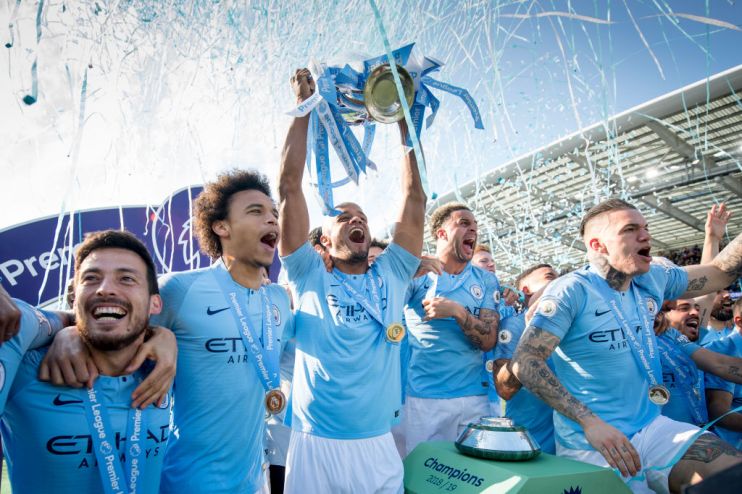 BRIGHTON, ENGLAND - MAY 12: Vincent Kompany of Manchester City lifts the Premier League trophy after the Premier League match between Brighton & Hove Albion and Manchester City at American Express Community Stadium on May 12, 2019 in Brighton, United Kingdom. (Photo by Michael Regan/Getty Images)