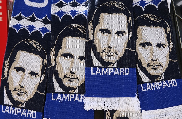 Scarves featuring the image of Chelsea's newly appointed English head coach Frank Lampard are pictured ahead of his unveiling press conference at Stamford Bridge in London on July 4, 2019. - Frank Lampard was appointed Chelsea head coach on Thursday, confirming a dramatic return for one of the club's greatest ever players. Lampard has signed a three-year contract with the Premier League club, where he spent 13 years and became the team's all-time leading scorer with 211 goals. (Photo by ISABEL INFANTES / AFP) (Photo credit should read ISABEL INFANTES/AFP/Getty Images)