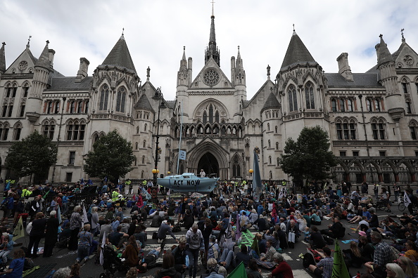 LONDON, ENGLAND - JULY 15: Extinction Rebellion protesters block traffic on the Strand as the environmental protest group begin a series of planned week-long protests, collectively called 'Project Mushroom', on July 15, 2019 in London, United Kingdom. Extinction Rebellion are a socio-political movement which uses civil disobedience and nonviolent resistance to protest against climate breakdown, biodiversity loss, and the risk of social and ecological collapse. (Photo by Dan Kitwood/Getty Images)