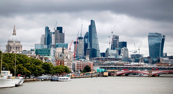 Construction cranes stand anear skyscrapers in the City of London, including the Heron Tower, Tower 42, 30 St Mary Axe commonly called the "Gherkin", the Leadenhall Building, commonly called the "Cheesegrater", and 20 Fenchurch Street, commonly called the "Walkie-Talkie" building, as they are pictured from Waterloo Bridge in London, on August 17, 2017. British retail sales rose in July, slightly beating expectations, official data showed on Thursday, even though household incomes are still feeling the squeeze from a Brexit-fuelled slump in the pound. / AFP PHOTO / Tolga Akmen (Photo credit should read TOLGA AKMEN/AFP/Getty Images)
