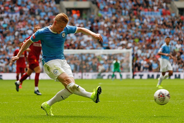Manchester City's Belgian midfielder Kevin De Bruyne plays the ball into the box during the English FA Community Shield football match between Manchester City and Liverpool at Wembley Stadium in north London on August 4, 2019. (Photo by Adrian DENNIS / AFP) / NOT FOR MARKETING OR ADVERTISING USE / RESTRICTED TO EDITORIAL USE (Photo credit should read ADRIAN DENNIS/AFP/Getty Images)