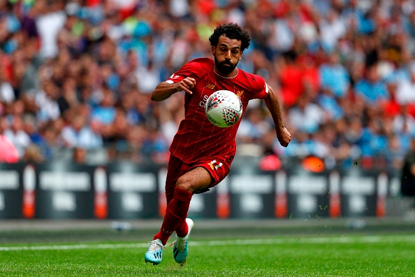 TOPSHOT - Liverpool's Egyptian midfielder Mohamed Salah runs with the ball during the English FA Community Shield football match between Manchester City and Liverpool at Wembley Stadium in north London on August 4, 2019. (Photo by Adrian DENNIS / AFP) / NOT FOR MARKETING OR ADVERTISING USE / RESTRICTED TO EDITORIAL USE (Photo credit should read ADRIAN DENNIS/AFP/Getty Images)