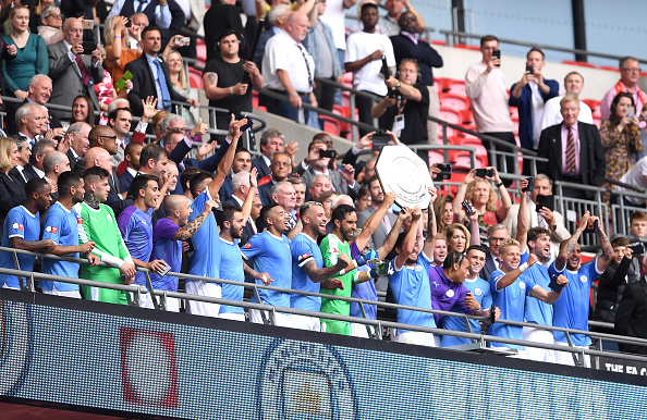 LONDON, ENGLAND - AUGUST 04: David Silva and Sergio Aguero of Manchester City lift the FA Community Shield following their team's victory in the FA Community Shield match between Liverpool and Manchester City at Wembley Stadium on August 04, 2019 in London, England. (Photo by Laurence Griffiths/Getty Images)