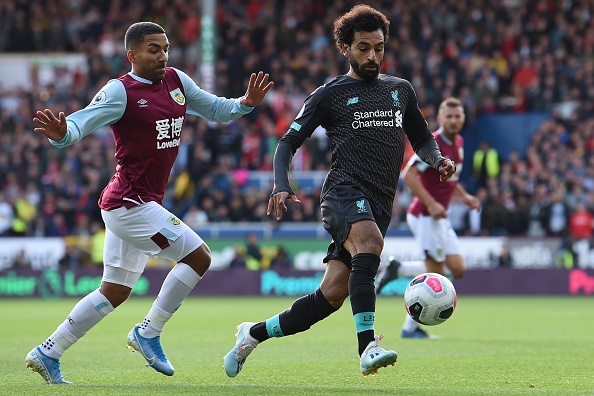 Liverpool's Egyptian midfielder Mohamed Salah (R) vies with Burnley's English midfielder Aaron Lennon (L) during the English Premier League football match between Burnley and Liverpool at Turf Moor in Burnley, north west England on August 31, 2019. (Photo by Paul ELLIS / AFP) / RESTRICTED TO EDITORIAL USE. No use with unauthorized audio, video, data, fixture lists, club/league logos or 'live' services. Online in-match use limited to 120 images. An additional 40 images may be used in extra time. No video emulation. Social media in-match use limited to 120 images. An additional 40 images may be used in extra time. No use in betting publications, games or single club/league/player publications. /         (Photo credit should read PAUL ELLIS/AFP/Getty Images)