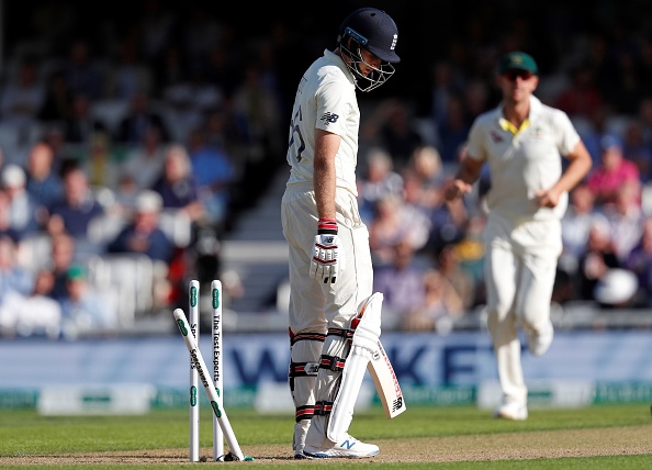 England's captain Joe Root looks at the stumps after losing his wicket for 57 runs during play on the first day of the fifth Ashes cricket Test match between England and Australia at The Oval in London on September 12, 2019. (Photo by Adrian DENNIS / AFP) / RESTRICTED TO EDITORIAL USE. NO ASSOCIATION WITH DIRECT COMPETITOR OF SPONSOR, PARTNER, OR SUPPLIER OF THE ECB (Photo credit should read ADRIAN DENNIS/AFP/Getty Images)