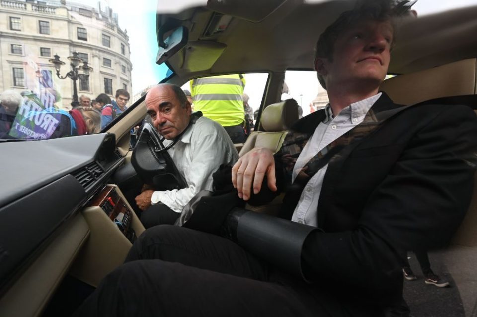 Extinction Rebellion: A hearse driver bike-locks his head to the steering wheel in Trafalgar Square (Getty)