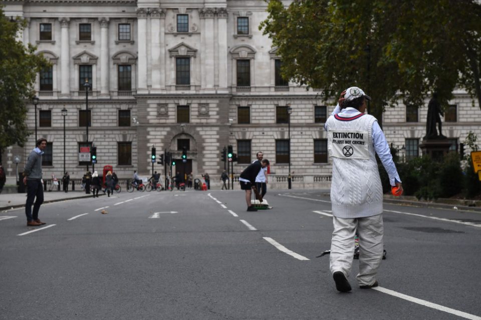 LONDON, ENGLAND - OCTOBER 07: Extinction Rebellion protesters play cricket at Parliament Square on October 7, 2019 in London, England. Climate change activists are gathering to block access to various government departments as they start a two week protest in central London (Photo by Chris J Ratcliffe/Getty Images)