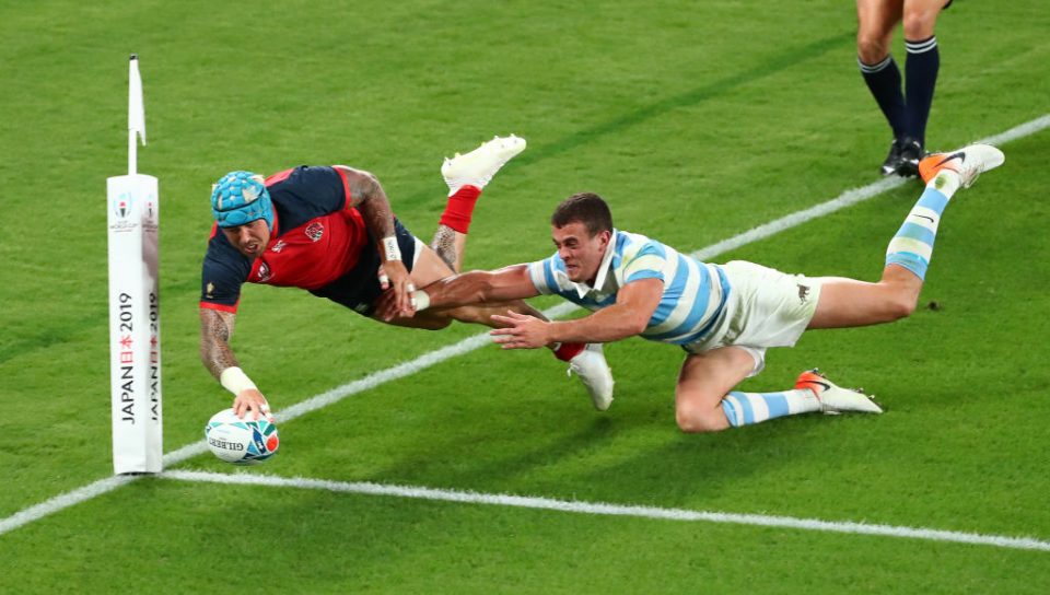 CHOFU, JAPAN - OCTOBER 05: England wing Jack Nowell dives over to score the 5th try despite the attentions of Argentina player Emiliano Boffelli during the Rugby World Cup 2019 Group C game between England and Argentina at Tokyo Stadium on October 05, 2019 in Chofu, Tokyo, Japan. (Photo by Stu Forster/Getty Images)