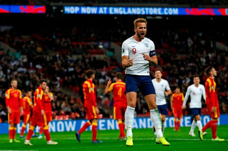England's striker Harry Kane (C) celebrates after scoring their third goal during the UEFA Euro 2020 qualifying first round Group A football match between England and Montenegro at Wembley Stadium in London on November 14, 2019. (Photo by Adrian DENNIS / AFP) / NOT FOR MARKETING OR ADVERTISING USE / RESTRICTED TO EDITORIAL USE (Photo by ADRIAN DENNIS/AFP via Getty Images)