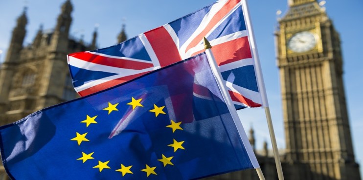 European Union and British Union Jack flag flying in front of Big Ben and the Houses of Parliament at Westminster Palace, London, in symbol of the Brexit EU referendum