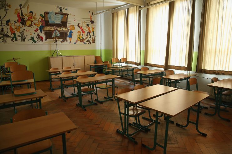Empty school tables. Pearson has pledged free courseware in the UK and US as thousands of schools close to combat the coronavirus crisis