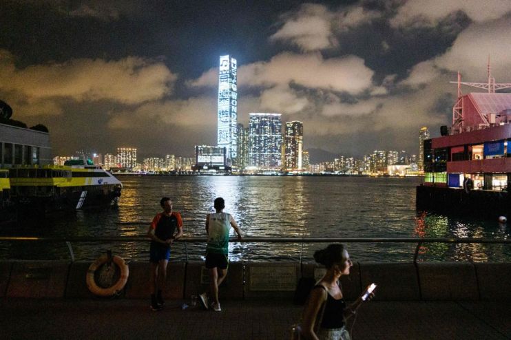 Hong Kong cut its economic outlook for the year today, saying a recovery from recession depended on how fast it can get a new wave of coronavirus infections under control.