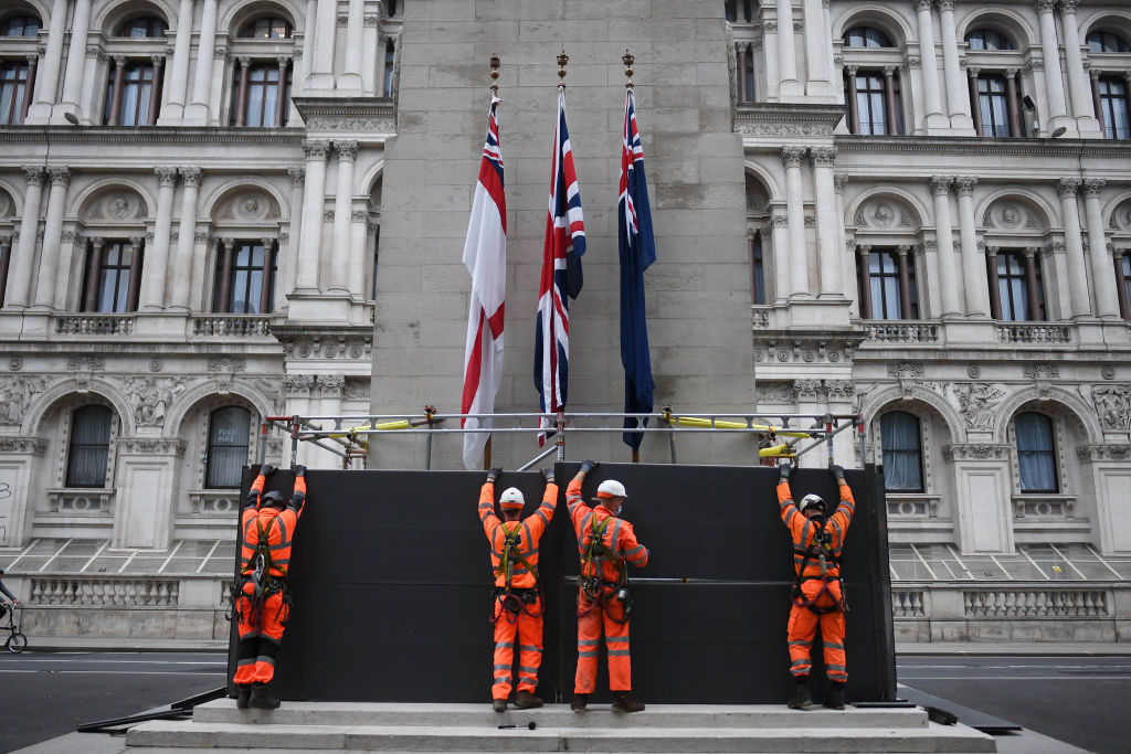 Workers erect a protective barrier around the Cenotaph in anticipation of London protests, with anti-racist protesters and far-right protesters set to clash