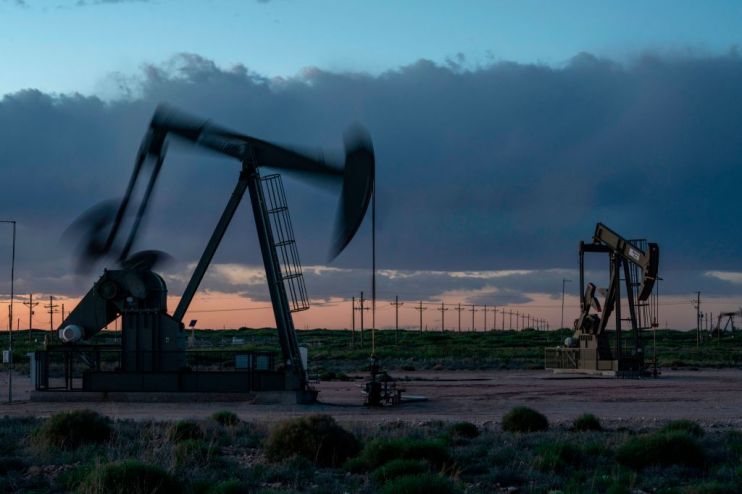 Global oil prices slid today amid growing concerns that producer cartel Opec would ease its record production curbs