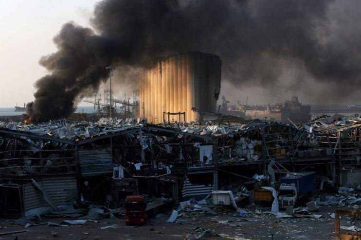 Smoke rises from a port facility after large explosions on August 4, 2020 in Beirut, Lebanon that have killed at least 78 people