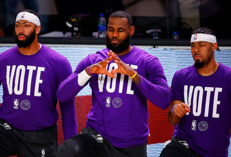 LeBron James (centre) brought the #MoreThanAVote movement to greater prominence in an example of sportspeople's greater influence on and engagement with wider issues