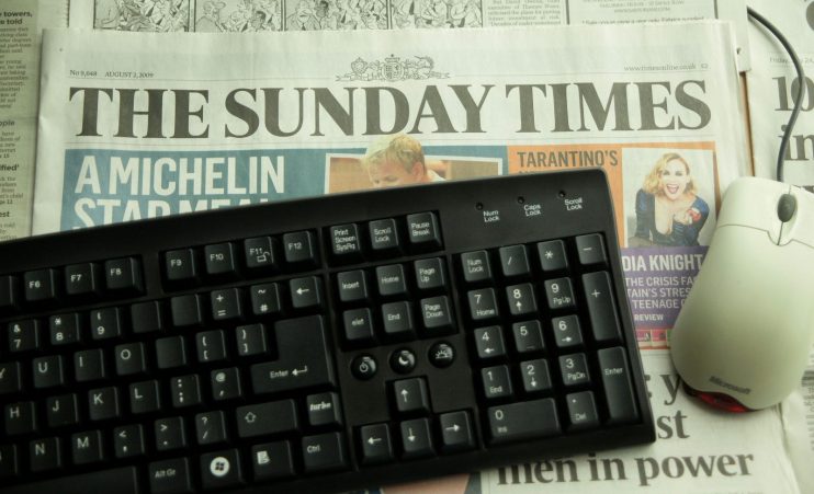 Newspaper Online Sites Consider Charging Users
