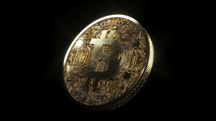 Bitcoin large on dark background - Image by SnapLaunch from Pixabay