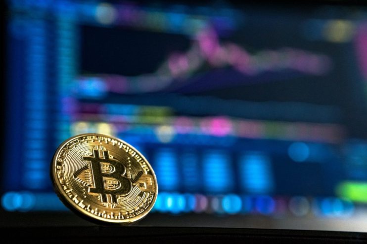Bitcoin with graph backdrop