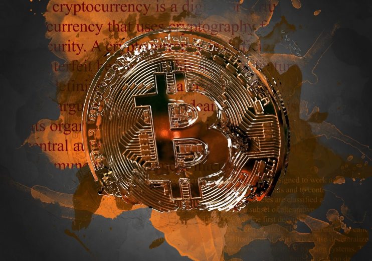 Bitcoin fragmented on words background