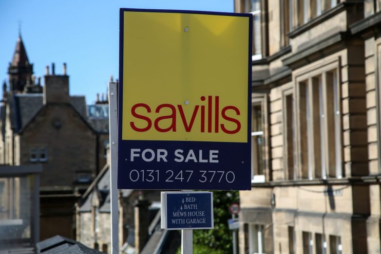 Commercial and residential estate agent Savills made a loss during the full year, as rising interest rates hindered activity.