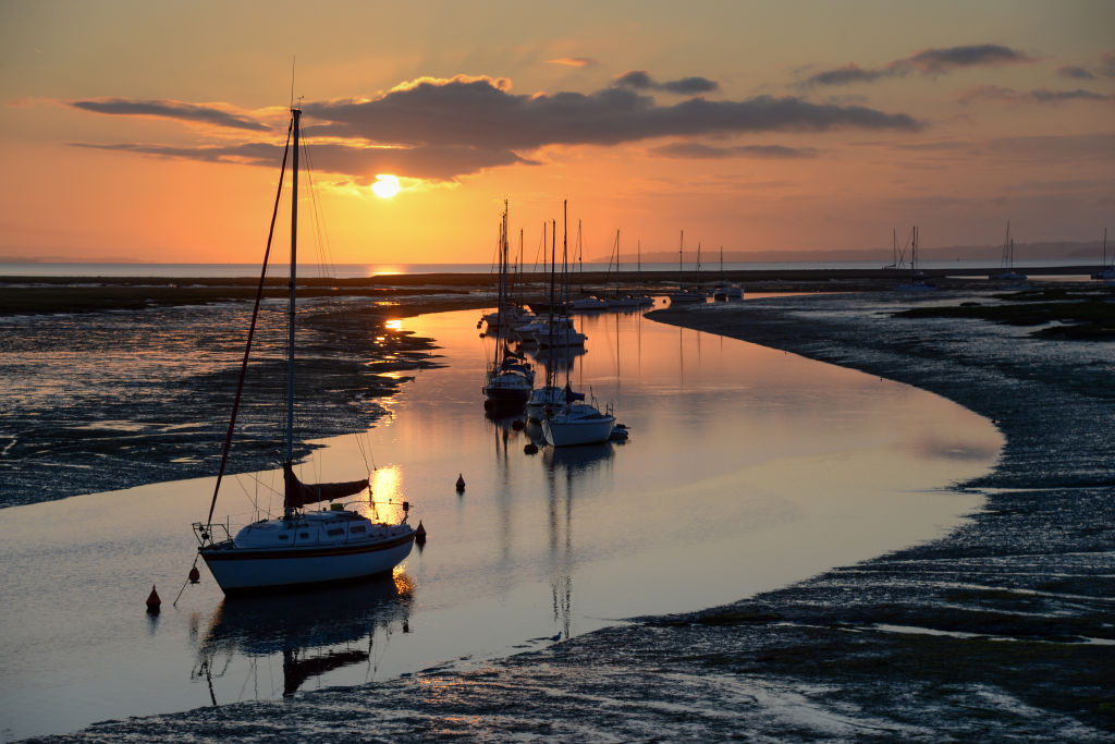 The sun rises at Keyhaven Lake next to Hurst Castle in Hampshire near Lymington, England.  (Photo by Finnbarr Webster/Getty Images)