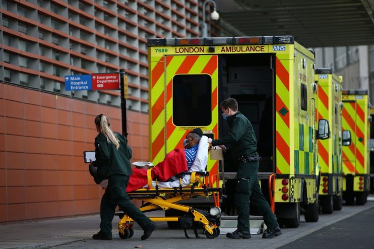 Ambulances queue up outside hospitals as Covid puts pressure on NHS