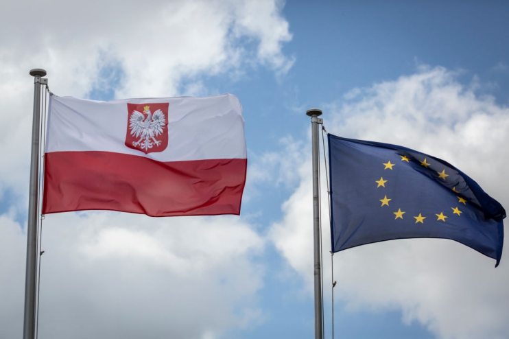 Polish national flag and EU flag.