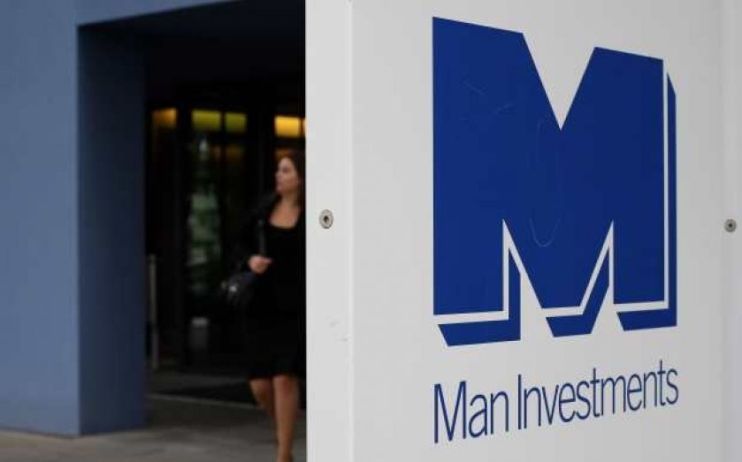 Man Group has been hit by the pound's devaluation against the dollar, reporting a negative forex impact of $4.5bn (£3.9bn).