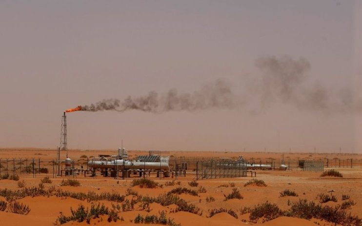 Saudi Aramco has sustained hefty payouts to its investors, including the country's government, despite a sharp slide in profits.