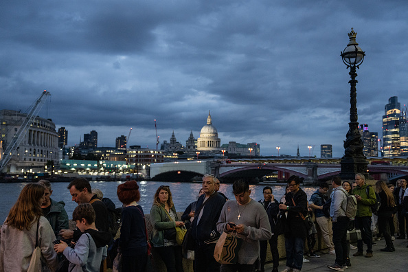 Queue for the Queen: People queue to visit the Palace of Westminster where the body of Queen Elizabeth II is lying in state 
 (Photo by Carl Court/Getty Images)