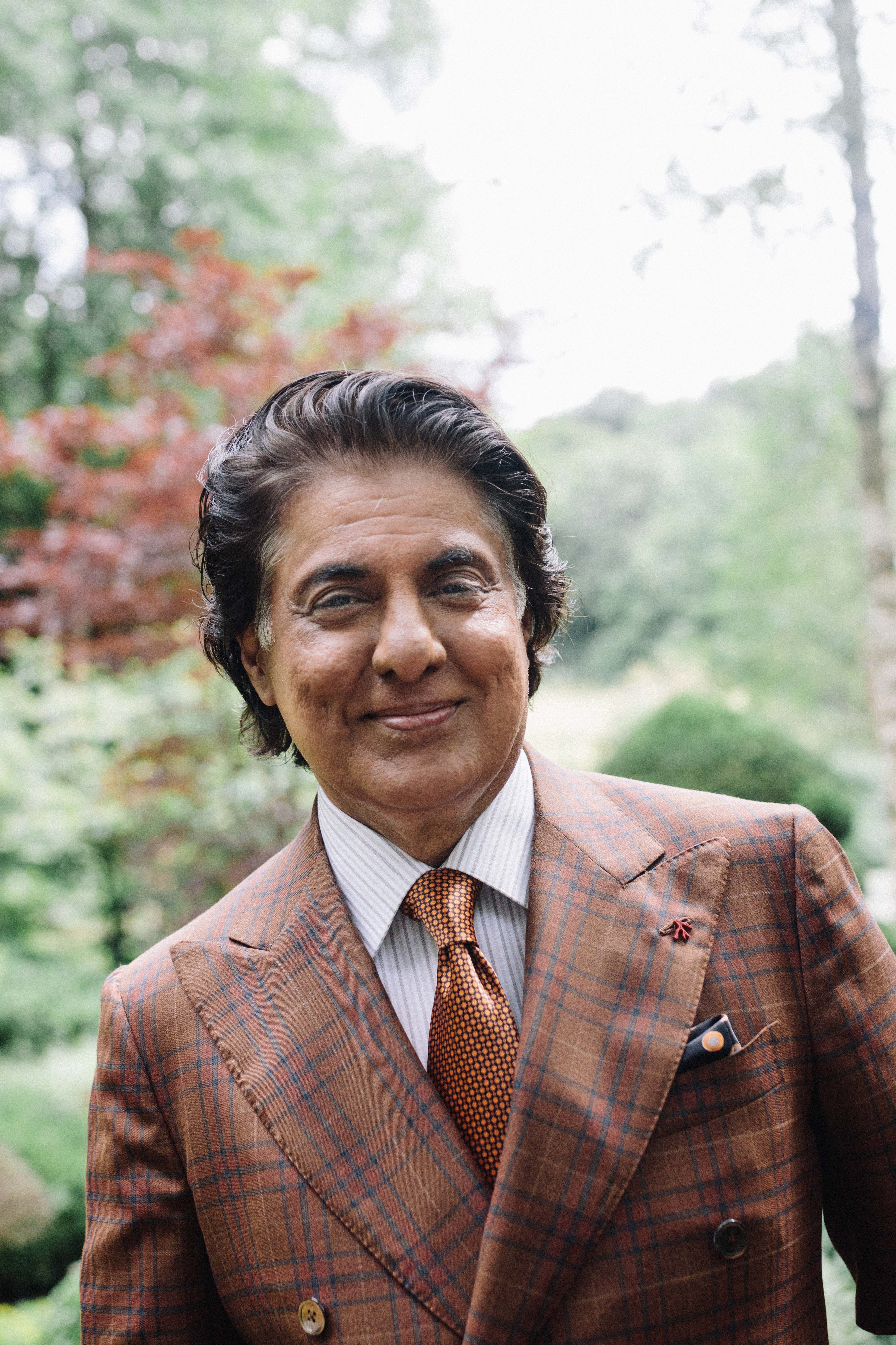Tej Kohli at his home in Oxfordshire, England Mr Kohli in one of his famous suits in his back garden.