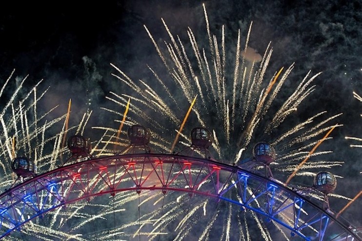 Fireworks light up the London Eye just after midnight in the centre of London (Photo by Ben Pruchnie/Getty Images)