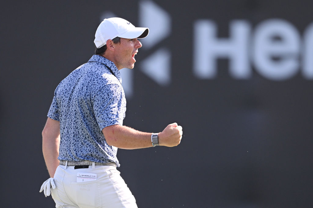 Rory McIlroy held off rival Patrick Reed to win the Dubai Desert Classic for a third time