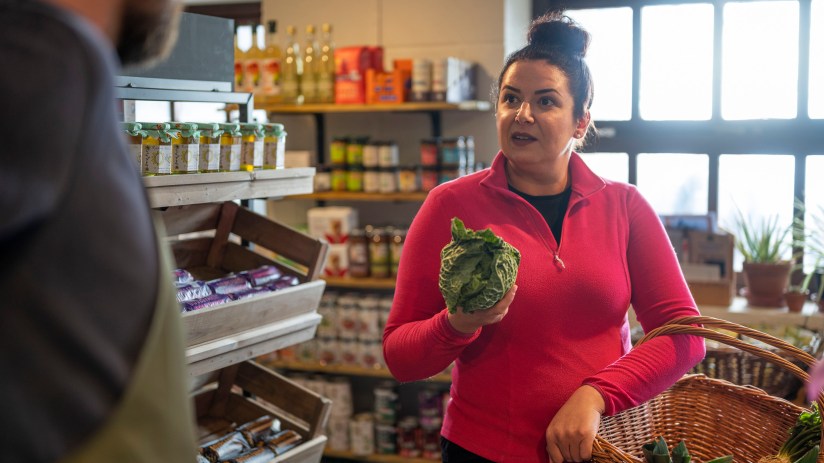 Grocery shopping, looking for discounts instead of high-end shops.