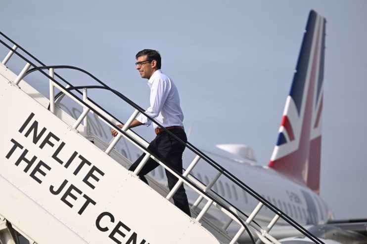 STANSTED, ESSEX - MARCH 12: Prime Minister Rishi Sunak boards a plane at Stansted Airport as he departs for the AUKUS Meeting in San Diego on March 12, 2023 in Stansted, Essex. President Biden hosts British Prime Minister Rishi Sunak and Australian Prime Minister Anthony Albanese in San Diego for an AUKUS meeting to discuss the procurement of nuclear-powered submarines under a pact between the three nations. (Photo by Leon Neal - WPA Pool/Getty Images)