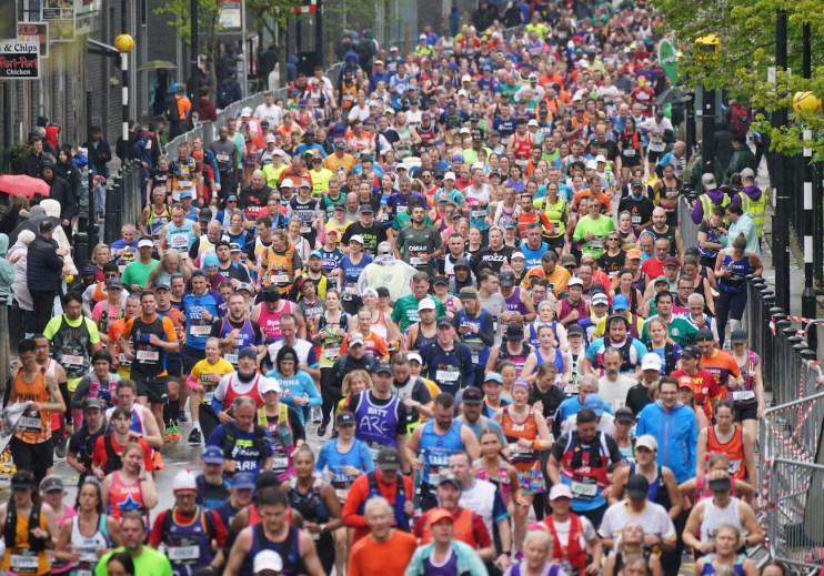 Runners reach the Isle of Dogs during the 2023 TCS London Marathon