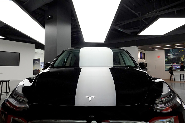 Electric Car Maker Tesla Reports Record Quarterly Earnings