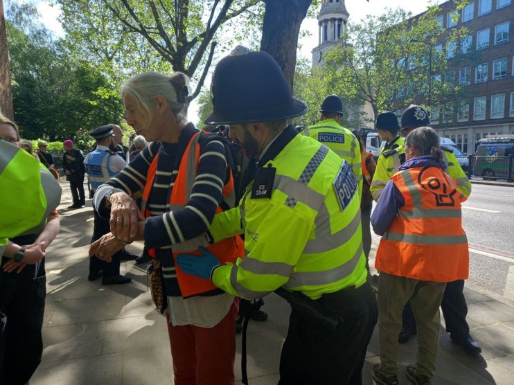 Just Stop Oil activists being detained during their march in central London. Six Just Stop Oil (JSO) protesters have been arrested in London after police orders were put in place to force supporters out of the road. Issue date: Wednesday May 24, 2023. PA Photo. See PA story POLICE Oil. Photo credit should read: Just Stop Oil/PA Wire NOTE TO EDITORS: This handout photo may only be used in for editorial reporting purposes for the contemporaneous illustration of events, things or the people in the image or facts mentioned in the caption. Reuse of the picture may require further permission from the copyright holder.