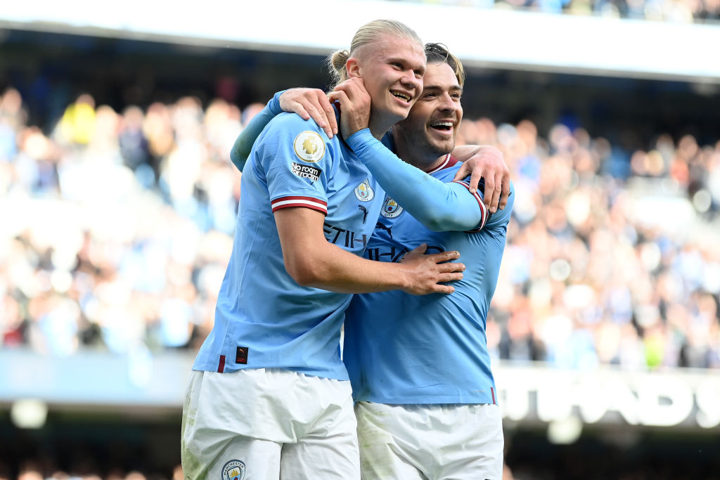 MANCHESTER, ENGLAND - OCTOBER 02: Erling Haaland of Manchester City celebrates their sides fifth goal and their hat trick with team mate Jack Grealish during the Premier League match between Manchester City and Manchester United at Etihad Stadium on October 02, 2022 in Manchester, England. (Photo by Michael Regan/Getty Images)