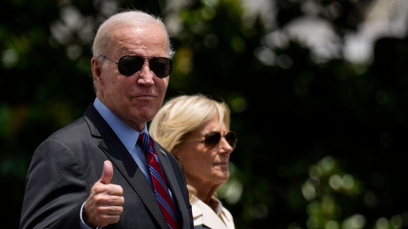 President Joe Biden gives a thumbs up as he walks with first lady Jill Biden to Marine One on the South Lawn of the White House (Photo by Drew Angerer/Getty Images)