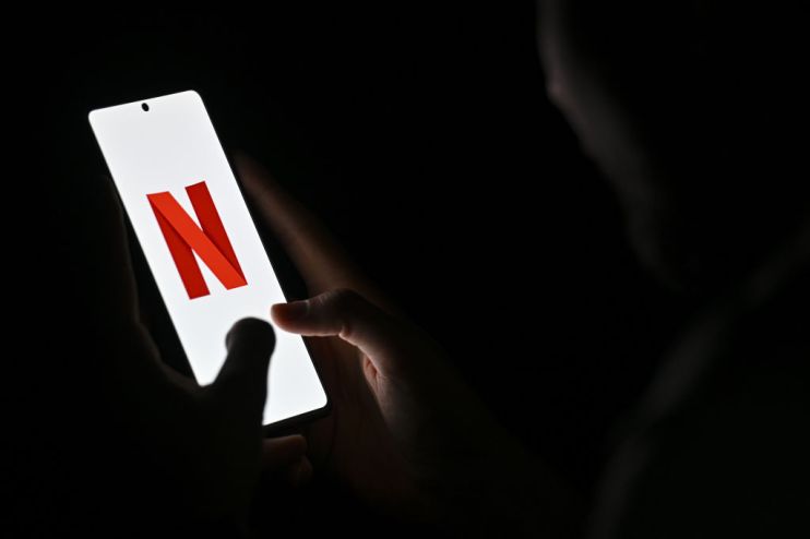 Netflix shares sink as company announces halt in reporting subscriber tally, weak outlook