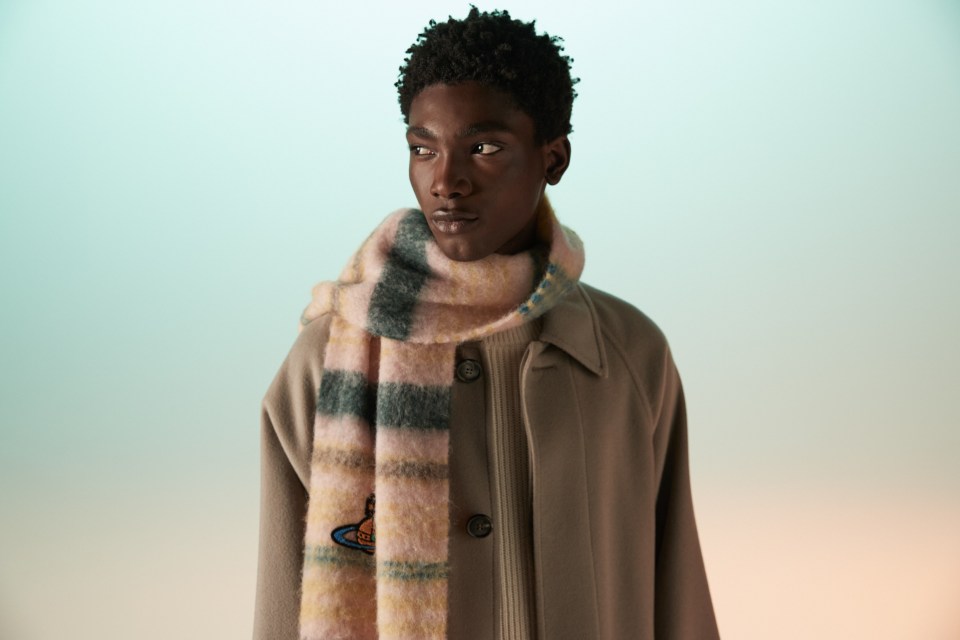 A man wearing a Vivienne Westwood scarf.