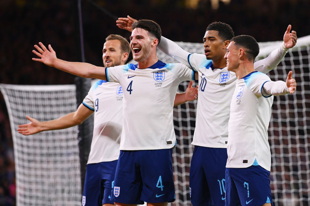 GLASGOW, SCOTLAND - SEPTEMBER 12: Jude Bellingham of England (2R) celebrates with teammates Harry Kane, Declan Rice and Phil Foden after scoring the team's second goal during the 150th Anniversary Heritage Match between Scotland and England at Hampden Park on September 12, 2023 in Glasgow, Scotland. (Photo by Stu Forster/Getty Images)