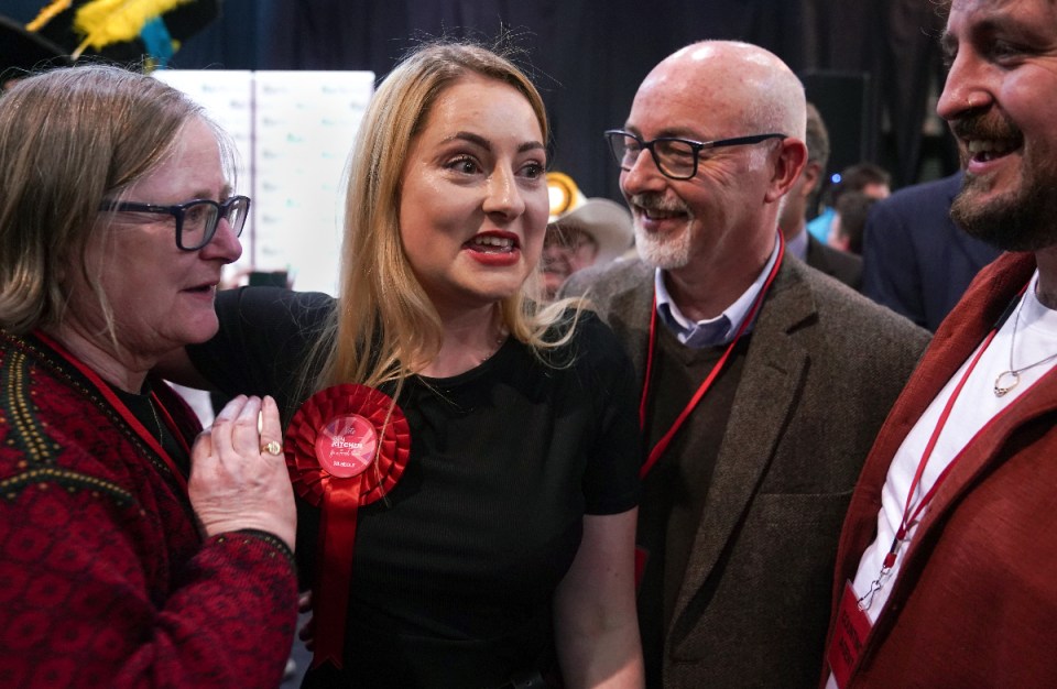 Labour Party candidate Gen Kitchen celebrates with her family after being declared winner in the Wellingborough by-election at the Kettering Leisure Village, Northamptonshire.