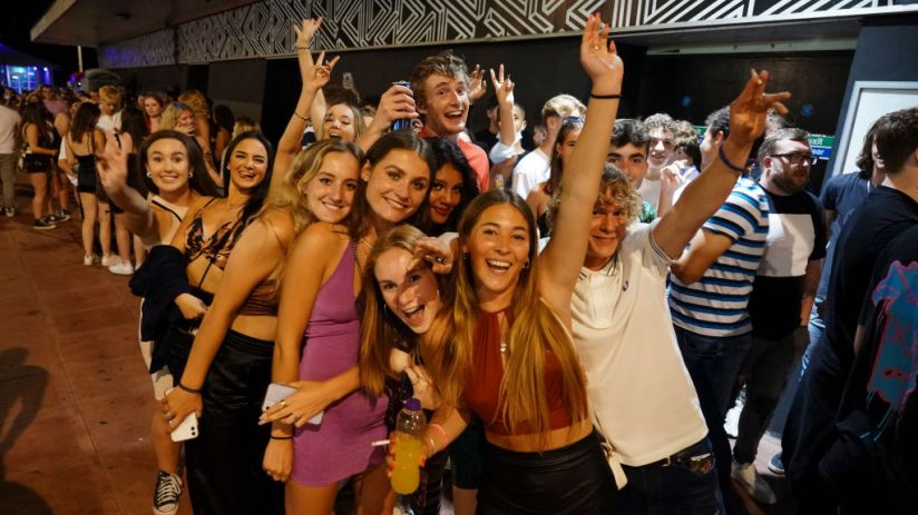 BRIGHTON, ENGLAND - JULY 18: Clubbers queue around the block at a few minutes to midnight waiting for Covid-19 restrictions to be dropped and for Pryzm nightclub to open its doors once more on July 18, 2021 in Brighton, England. At a minute past midnight, England dropped most of its remaining Covid-19 social restrictions, such as those requiring indoor mask-wearing and limits on group gatherings. These changes come despite rising infections, pitting the country's vaccination programme against the virus's more contagious Delta variant. (Photo by Chris Eades/Getty Images)