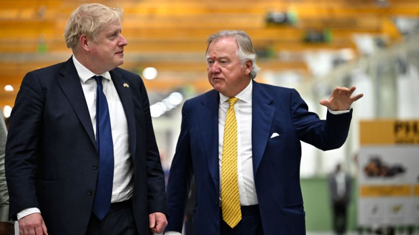 Then Prime Minister Boris Johnson with JCB chairman Lord Bamford during his visit at the JCB factory in Vadodara, Gujarat, during his two day trip to India on April 21, 2022. (Photo by Ben Stansall - WPA Pool/Getty Images)